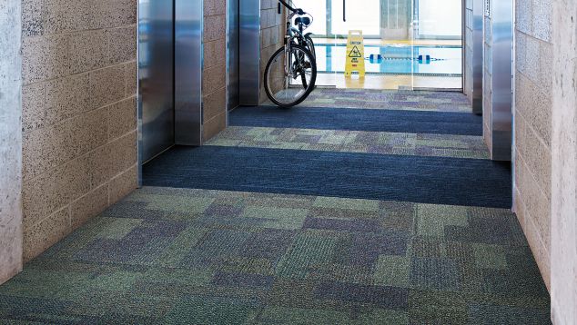 Interface The Standard and On Line carpet tile in hallway with bike