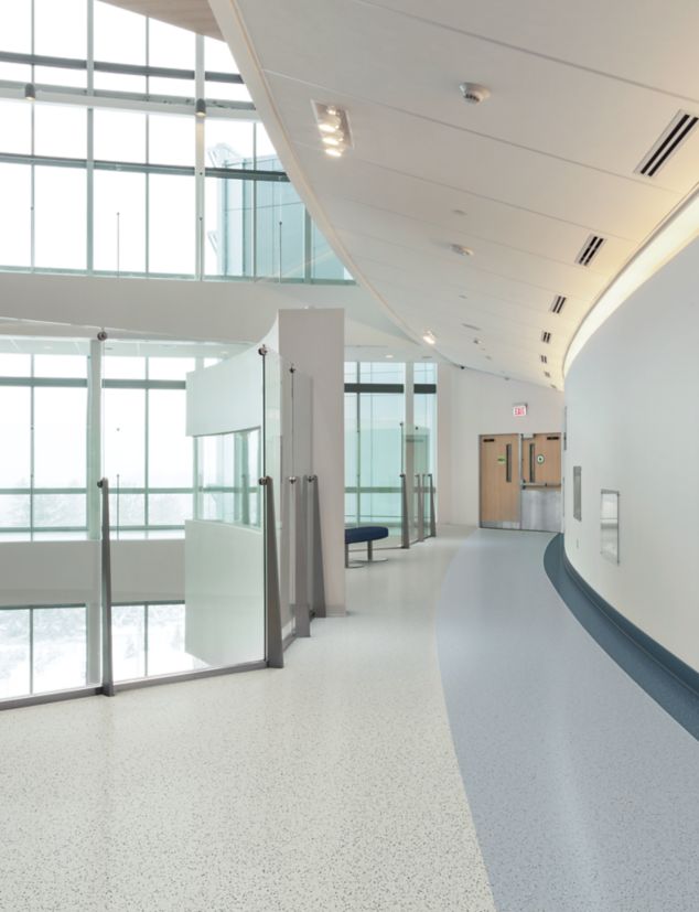 norament 926 pado rubber flooring in hospital corridor with glass walls