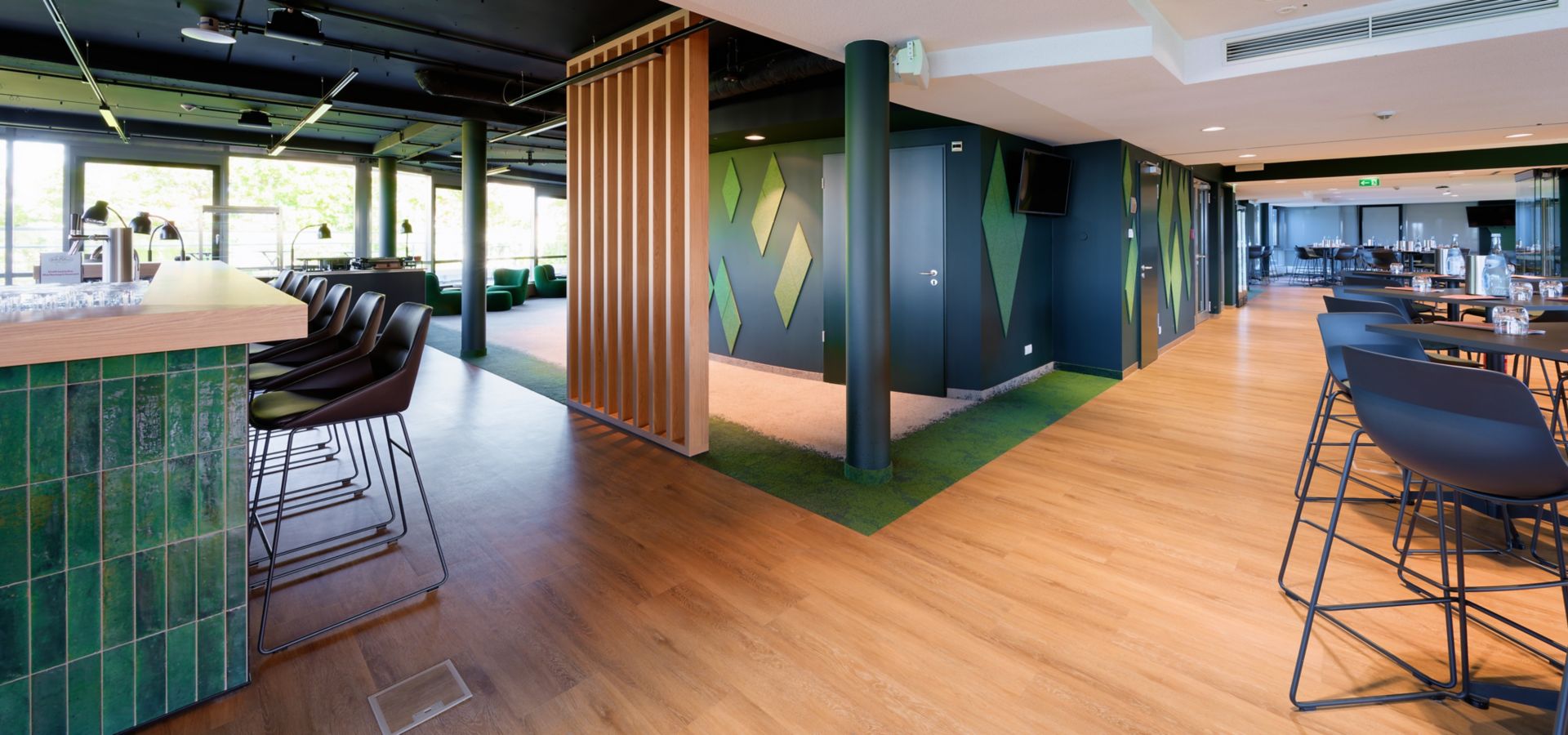 Interface Urban Retreat carpet tile and Level Set LVT in lounge setting