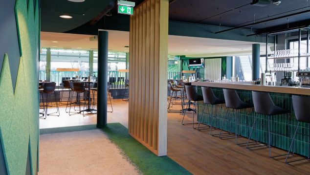 Interface Urban Retreat carpet tile and Level Set LVT in lounge setting
